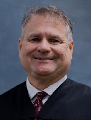 Circuit Judge Craig A. McCarthy