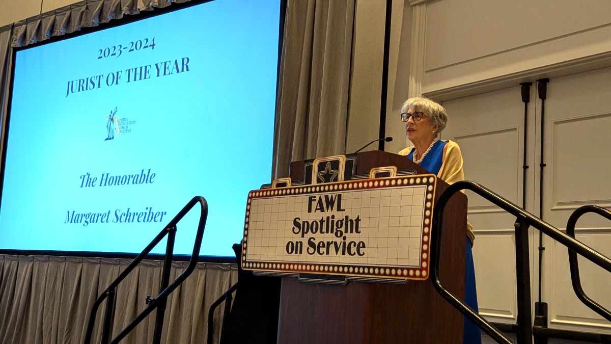 A photo of Judge Schreiber at a podium giving a speech after receiving the Jurist of the Year award from the Florida Association of Women Lawyers
