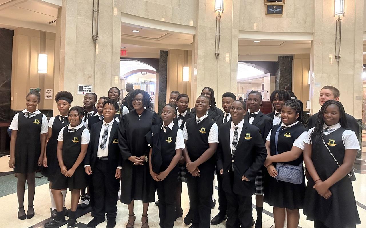 Circuit Judge Alicia Latimore with the students from the Deeper Root Academy