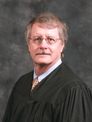 Senior Judge Daniel P. Dawson