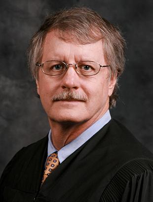 Senior Judge Daniel P. Dawson