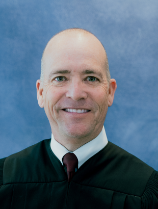 Circuit Judge Keith A. Carsten