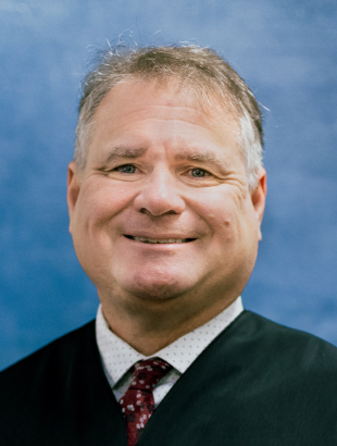 Circuit Judge Craig A. McCarthy