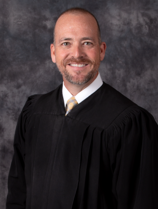 Circuit Judge Keith A. Carsten