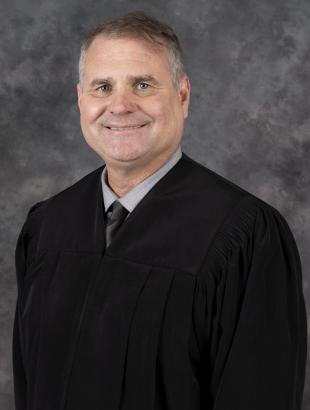 Circuit Judge Craig A. McCarthy