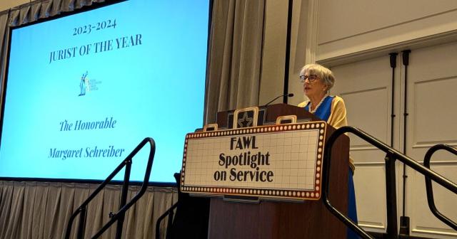 A photo of Judge Schreiber at a podium giving a speech after receiving the Jurist of the Year award from the Florida Association of Women Lawyers